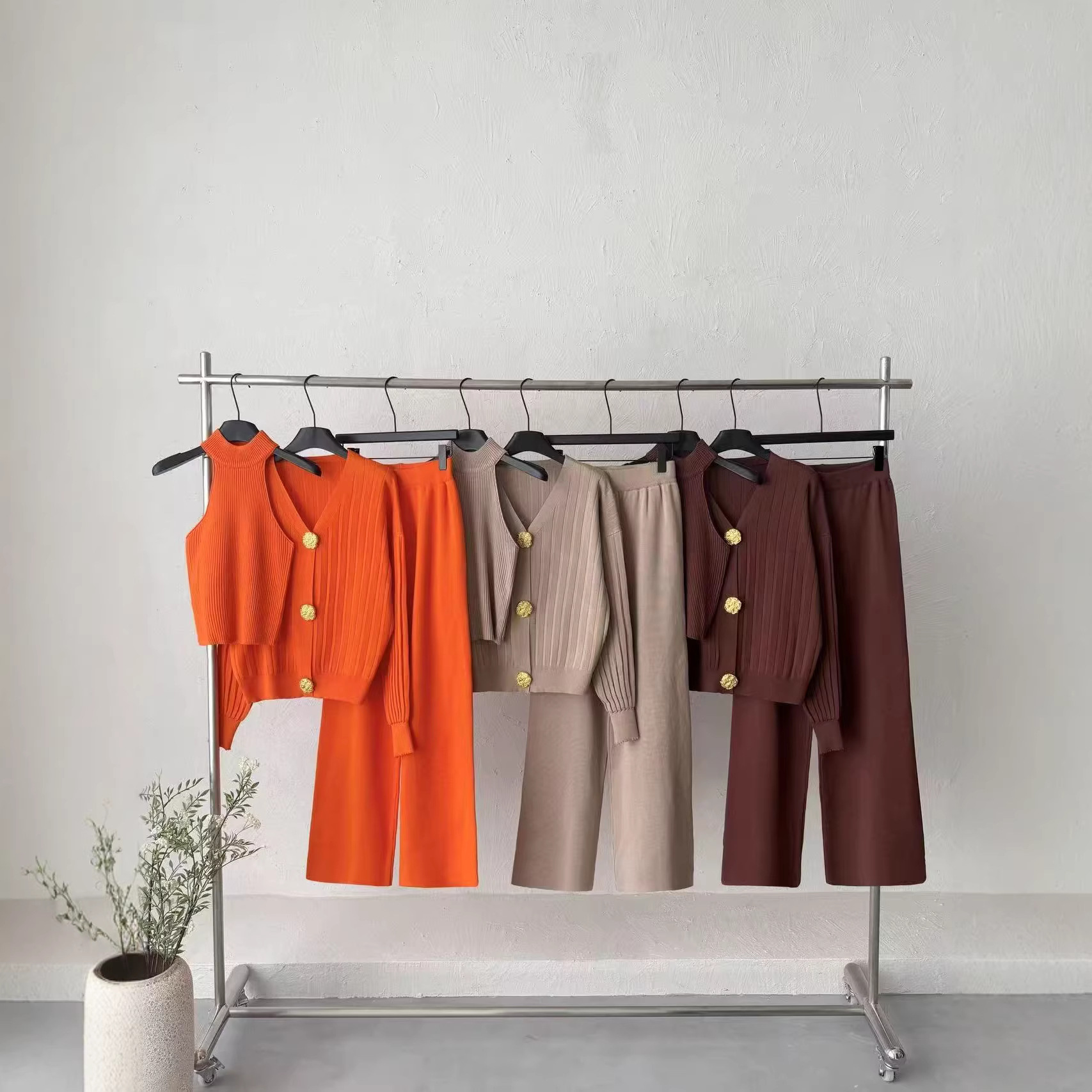 Cross border autumn and winter design sense metal buckle V-neck vest long sleeved knitted top casual high waist wide leg pants three piece set