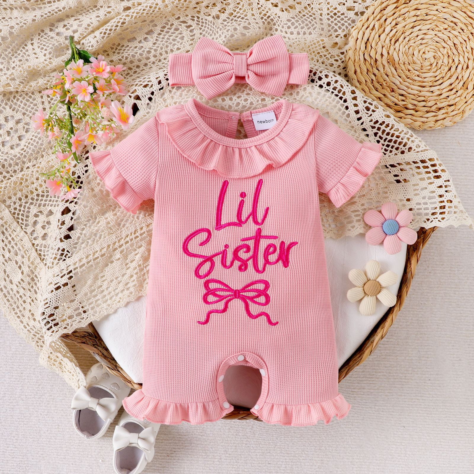 Girl's fresh pink jumpsuit, waffle style ruffled short sleeved shirt, Hani butterfly bow hair with baby in summer