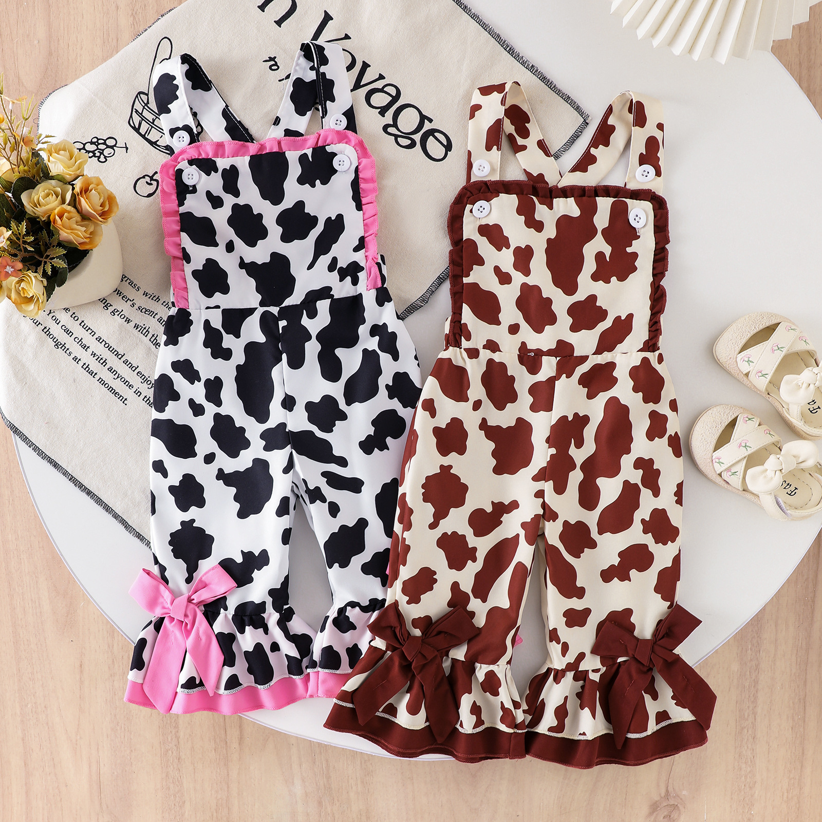 Girls' cow patterned overalls with black, white, brown, and white contrasting ruffle edge jumpsuit, summer casual set for baby girls