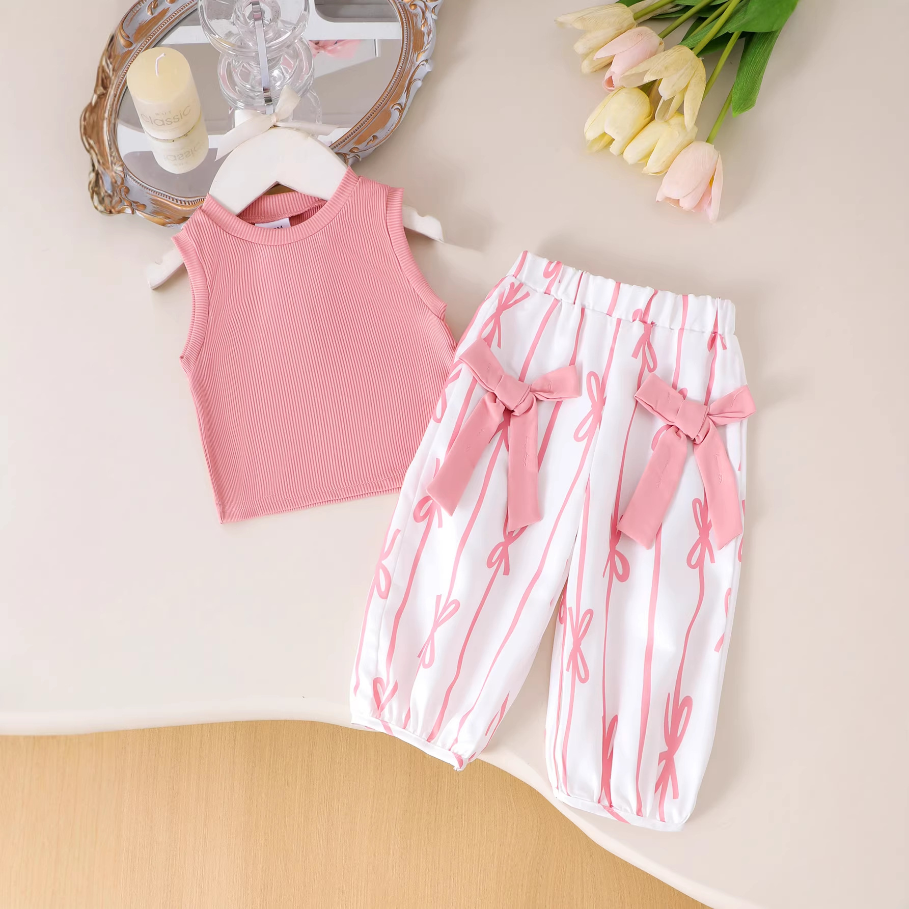 Children's stylish two-piece set with pink and white contrasting color pit stripe vest, bow printed lantern pants, girls' new style