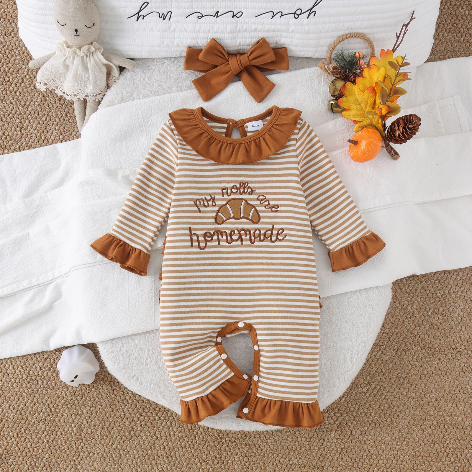 Baby autumn striped long sleeved jumpsuit with caramel colored ruffle collar and croissant embroidery